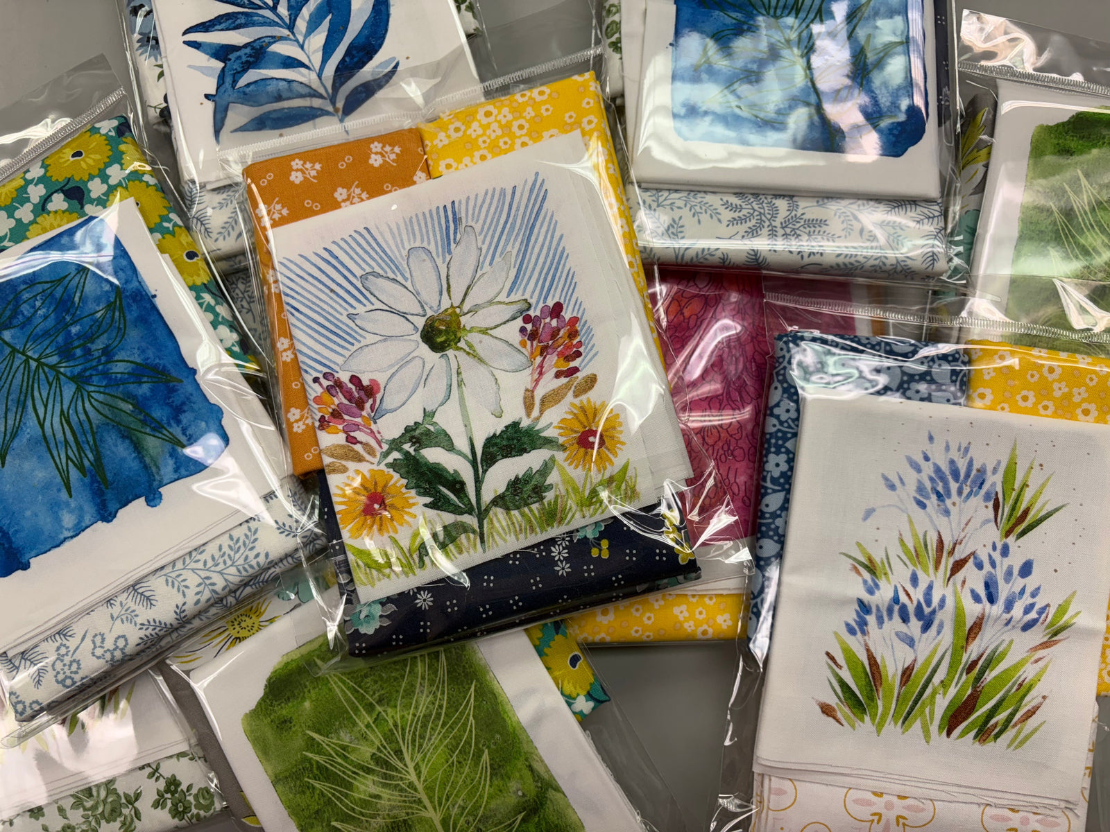 Collection of floral and nature-themed greeting cards in packaging